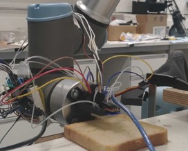 Multimodal sensor mounted on a UR3 interacting with toast